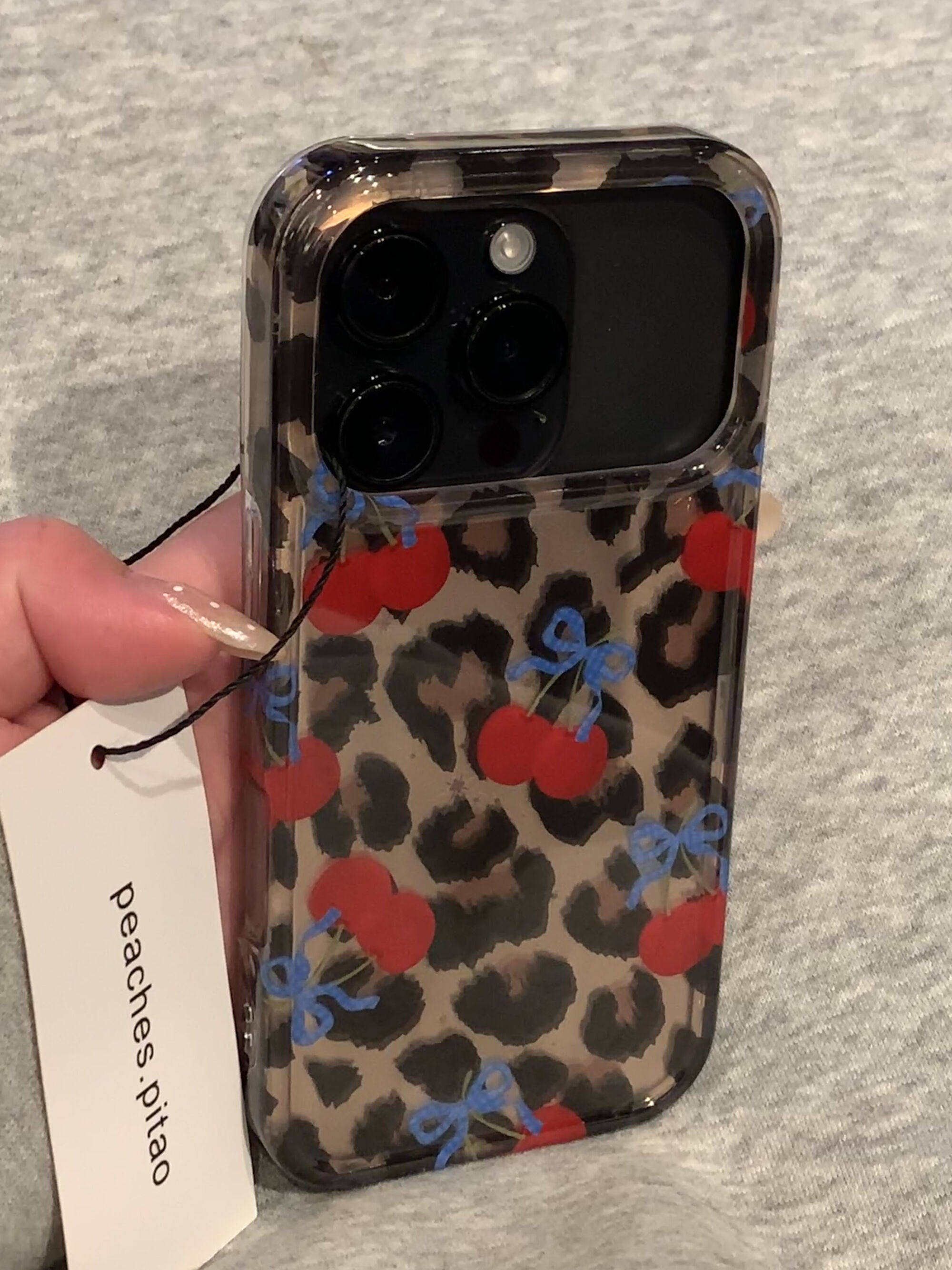 Ameigas Winter Cheetah Cherry Case - Insta-Fashion Design with Detachable Chain & Dual-Layer Hard Shell