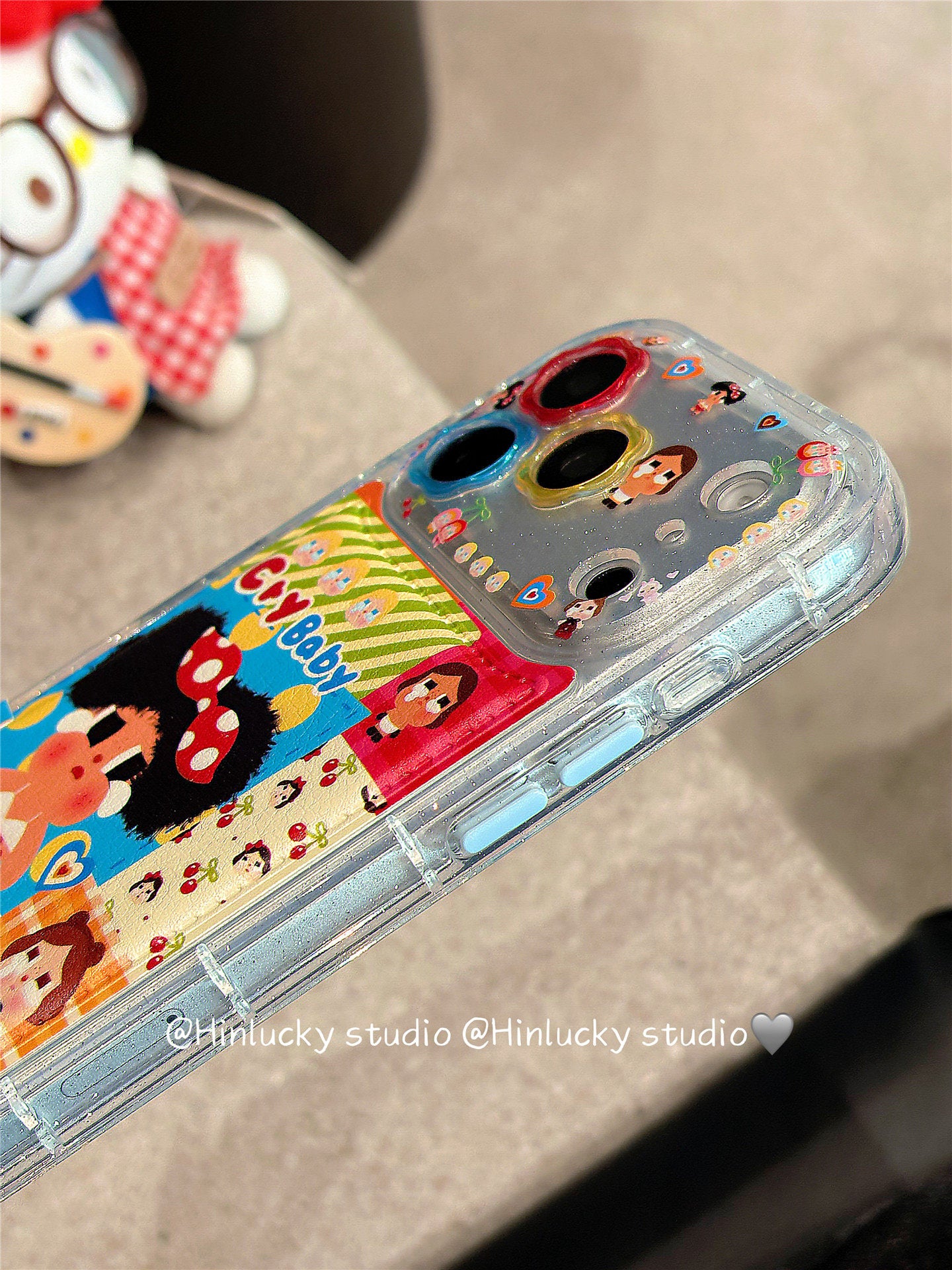 Ameigas Tearful Puff-Pop Case - Cartoon Crying Baby with Floral Leather Camera Accent