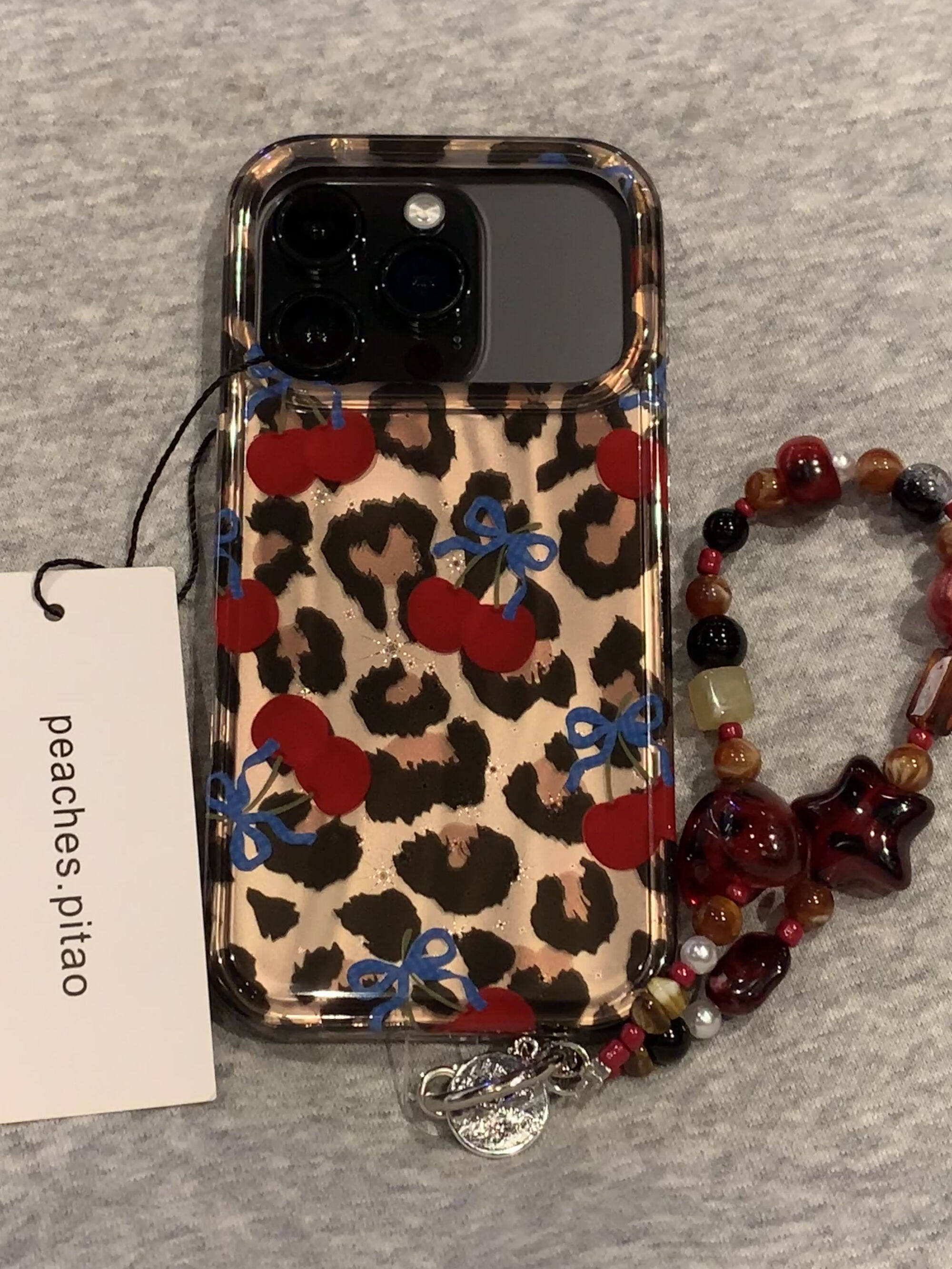 Ameigas Winter Cheetah Cherry Case - Insta-Fashion Design with Detachable Chain & Dual-Layer Hard Shell