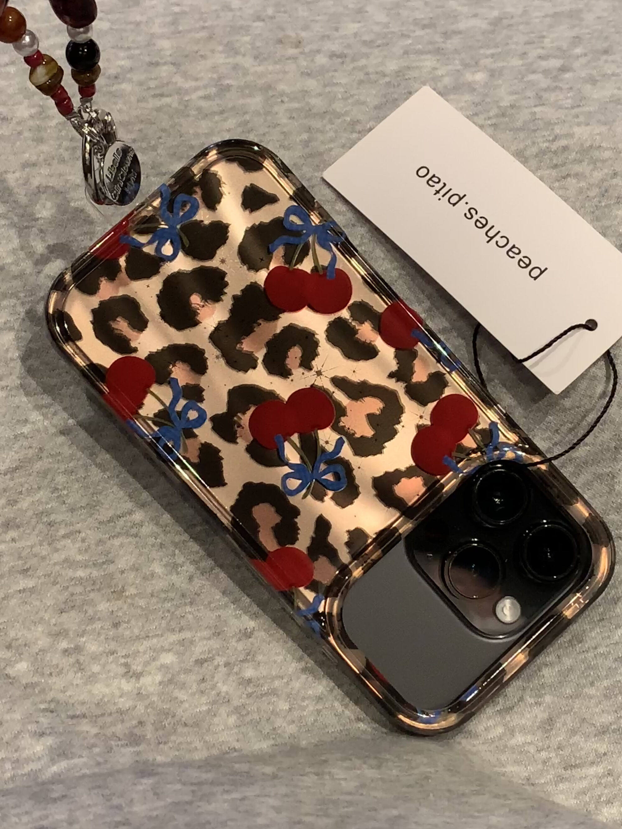Ameigas Winter Cheetah Cherry Case - Insta-Fashion Design with Detachable Chain & Dual-Layer Hard Shell
